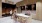 a group of people in a room with several tvs on the wall