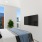 a room with a tv and windows