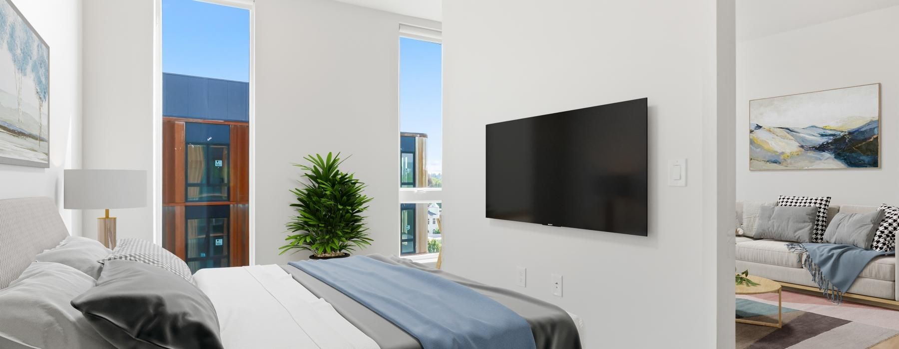 a room with a tv and windows