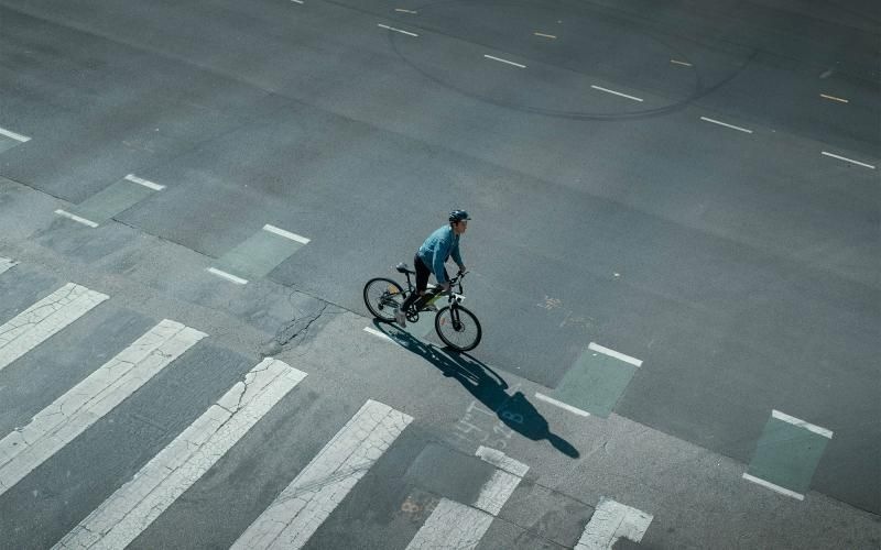 Find your perfect fit at Holloway Apartments a person riding a bicycle on a street